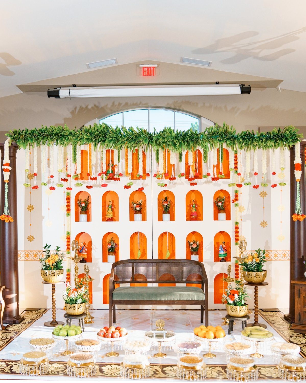 Orange ceremony stage with decorative niches