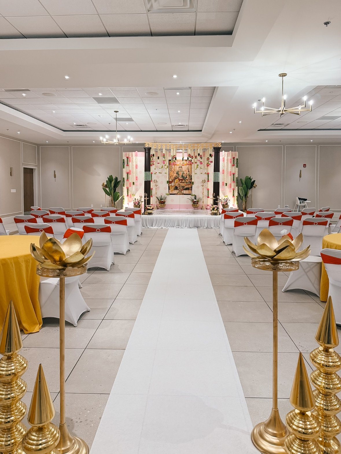 Wedding hall aisle leading to the decorated stage