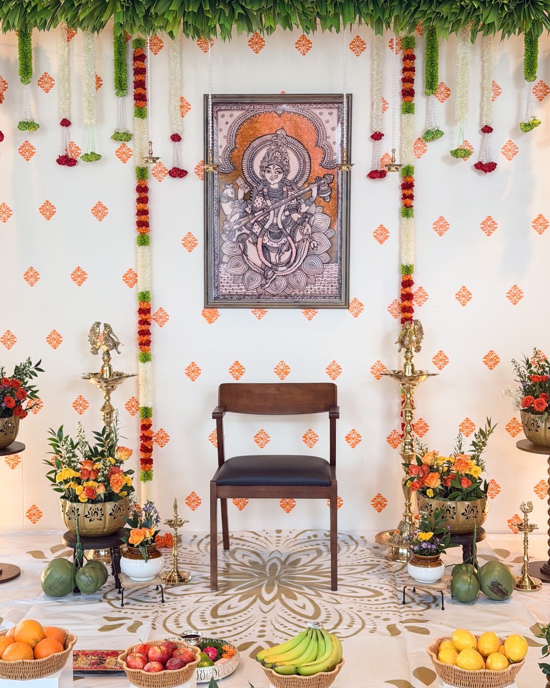 Ceremony stage with framed artwork and florals