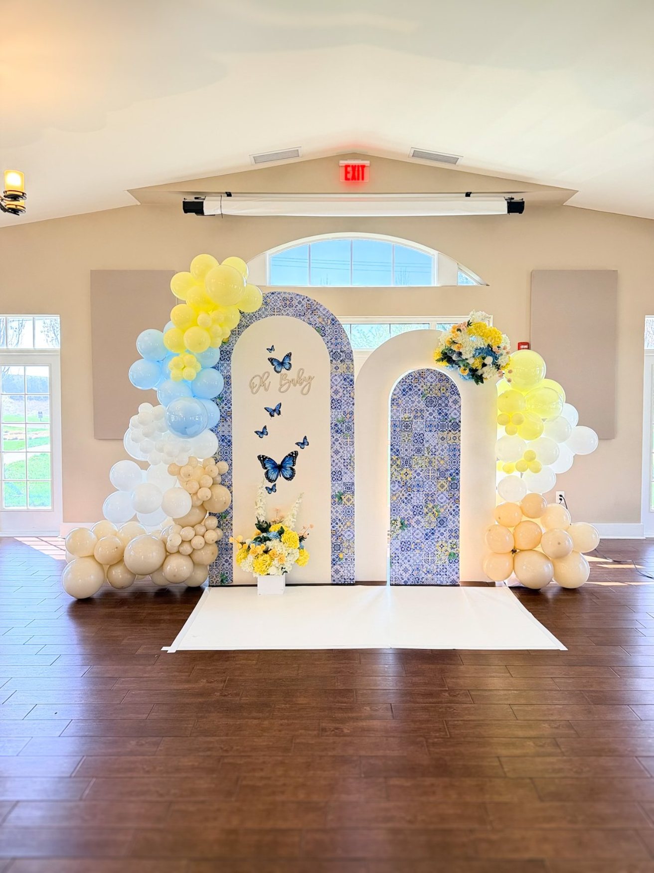 Baby shower balloon arch and floral backdrop