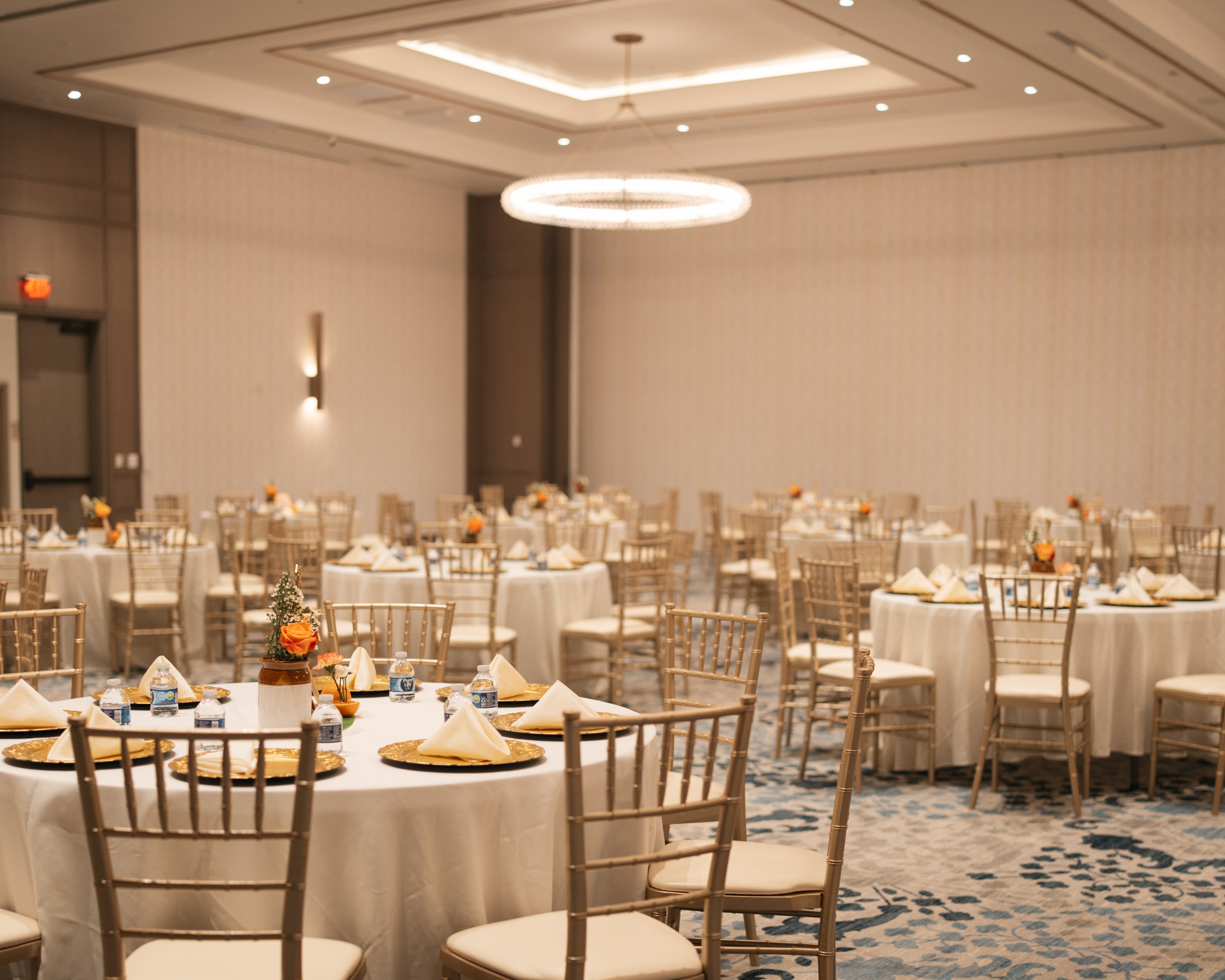 Reception tablescape with gold chargers and chiavari chairs